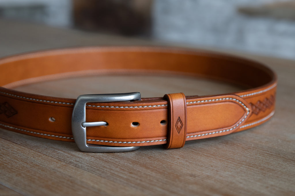 Handmade russet brown leather belt, stitched and embossed by hand. Rustic style with brushed nickle finish solid brass buckle.