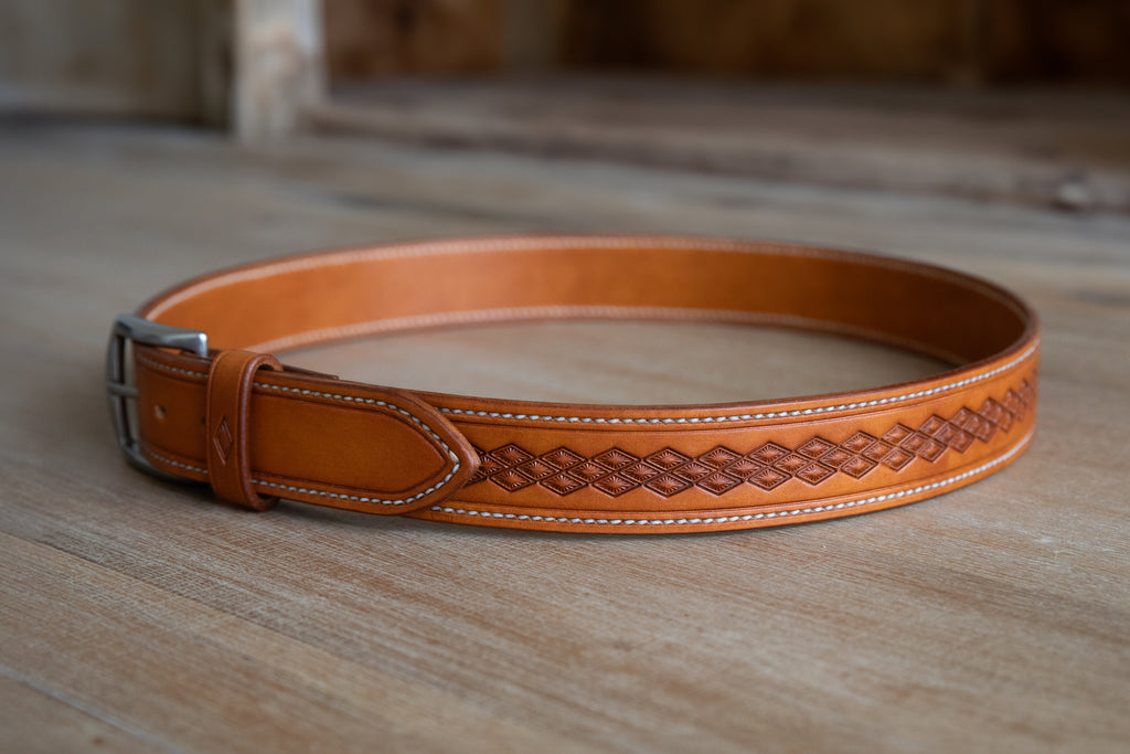 Handmade russet brown leather belt, stitched and embossed by hand. Rustic style with brushed nickle finish solid brass buckle.